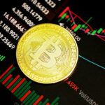 Single BTC coin warm light - Kanchanara / Unsplash