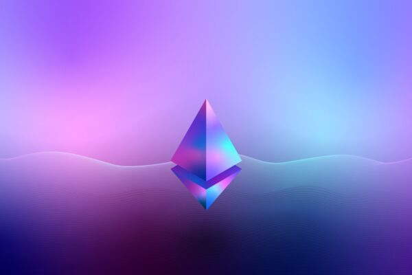 Insegna neon Bitcoin su sfondo scuro — proposta CEO StarkWare inflazione 4% per rimpiazzare cap 21 milioni BTC